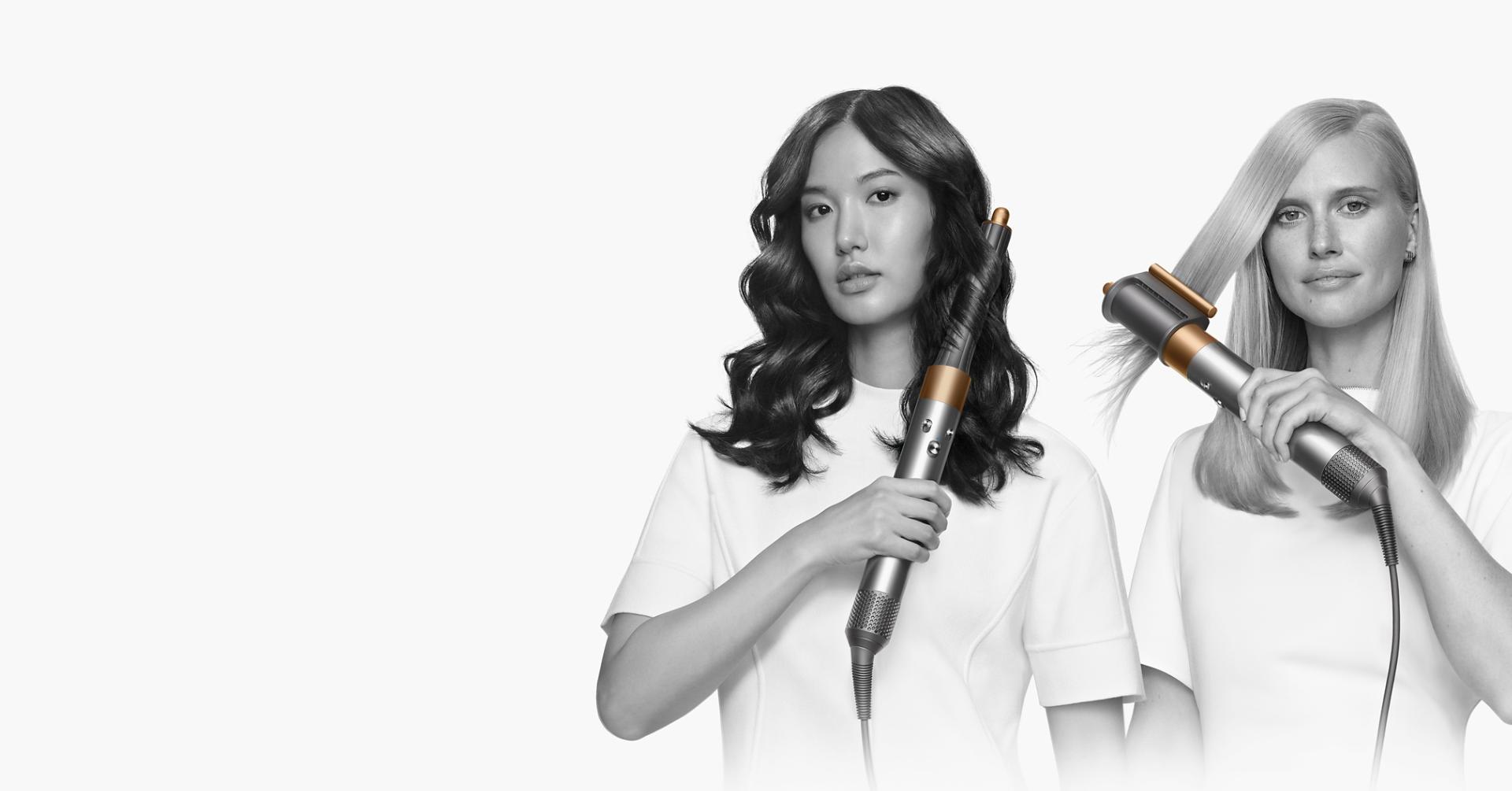 Model using a Dyson Airwrap to curl her hair