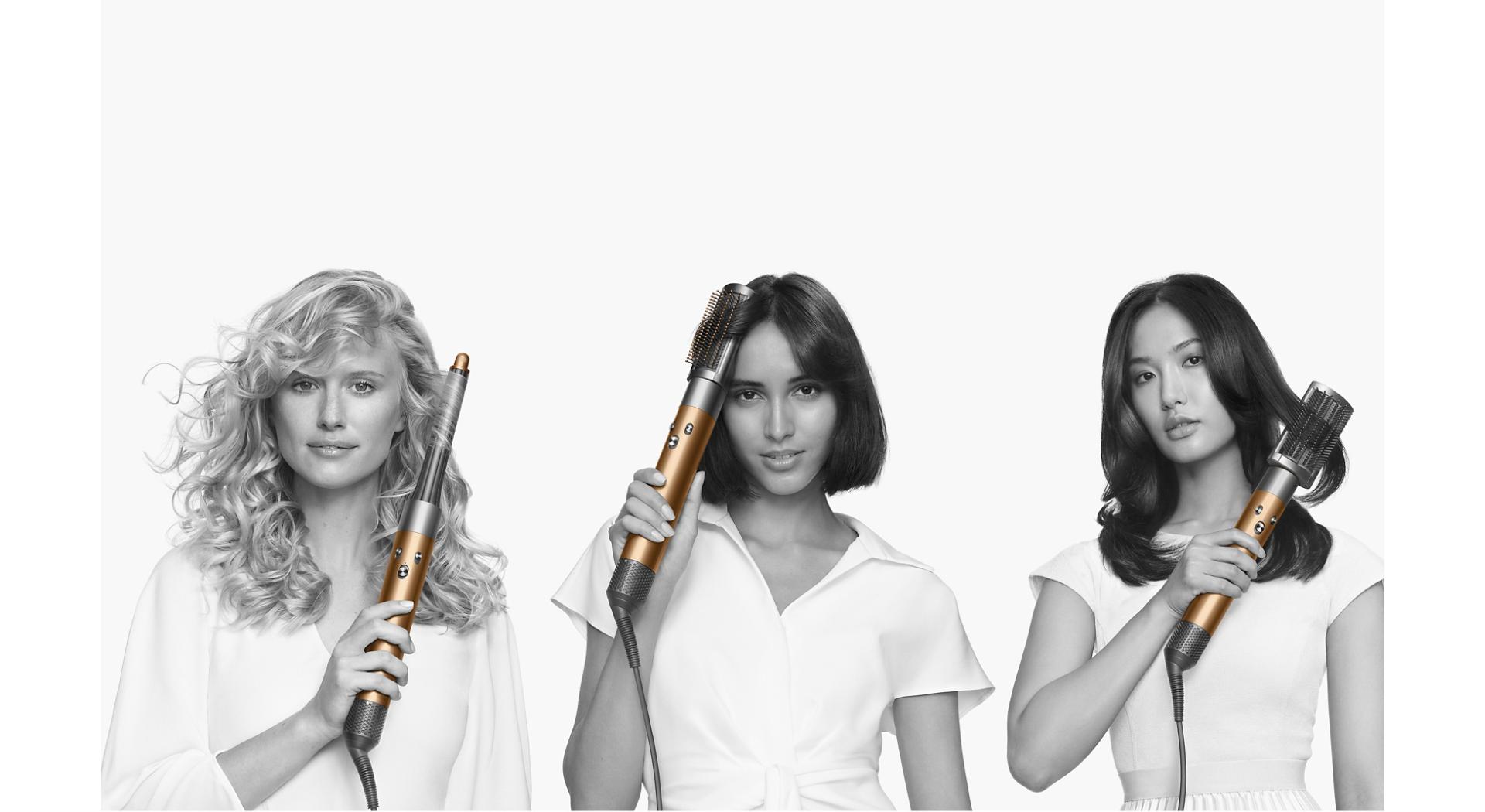 Models styling their hair with the Dyson Airwrap multi-styler