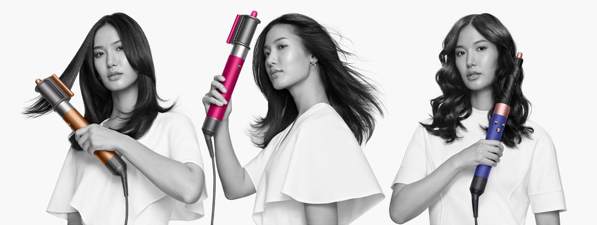 Models holding a Dyson Airwrap multi-styler with various attachments.
