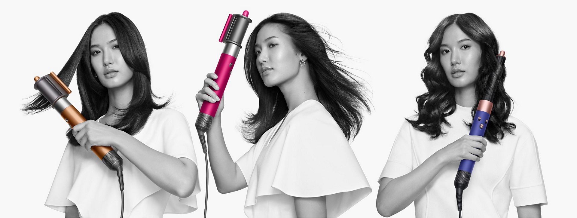 Models holding a Dyson Airwrap multi-styler with various attachments.
