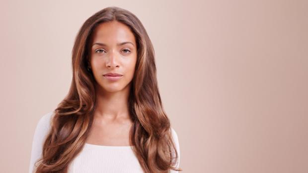 A model with styled blow-dried curls.