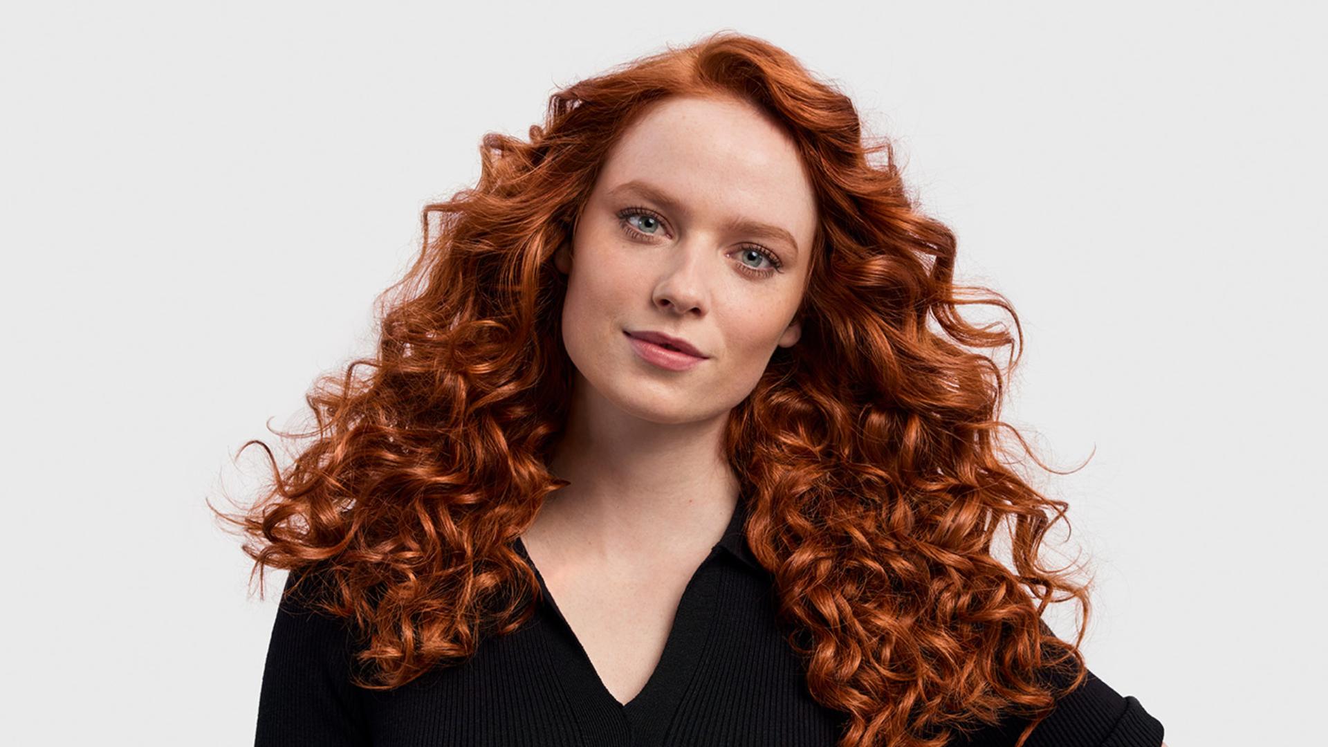 Model with her hair in an 80s style.