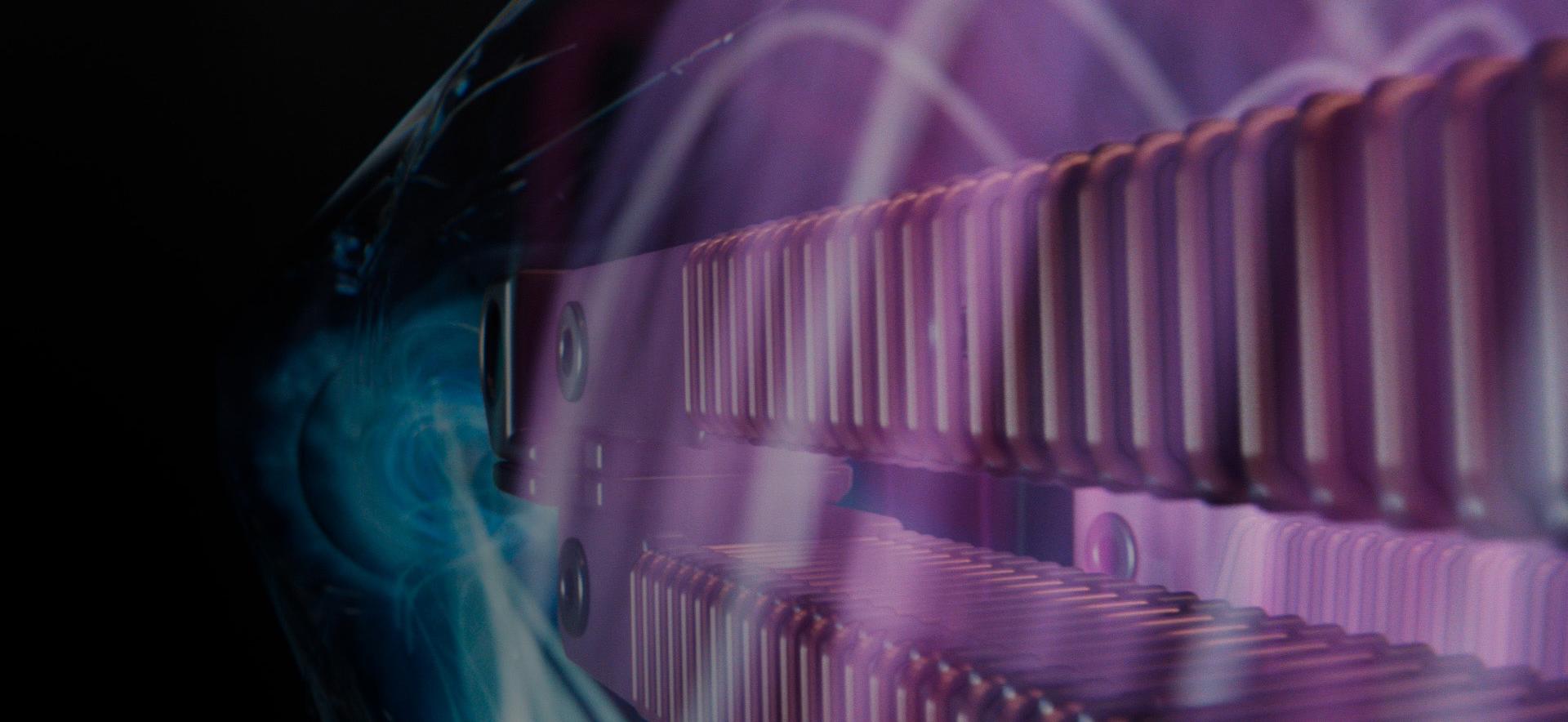 An animation of airflow, visualised in vibrant pink and blue, moves through a cutaway of a machine.