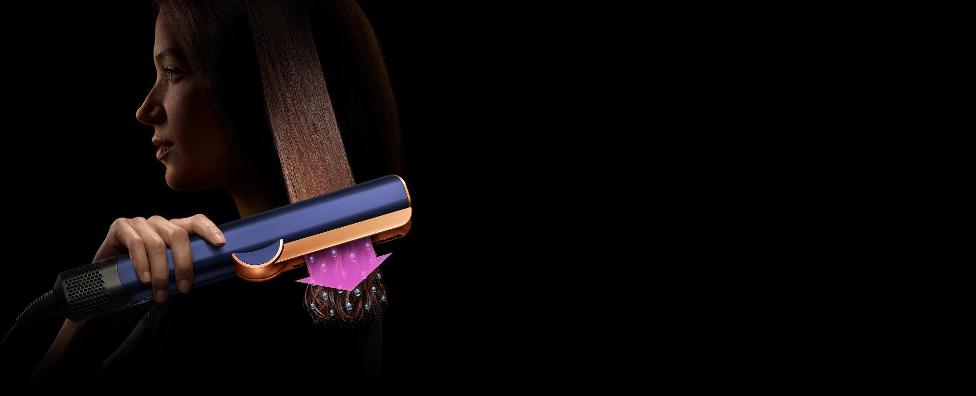 An animation of airflow, visualised in vibrant pink and blue, moves through a cutaway of a machine.