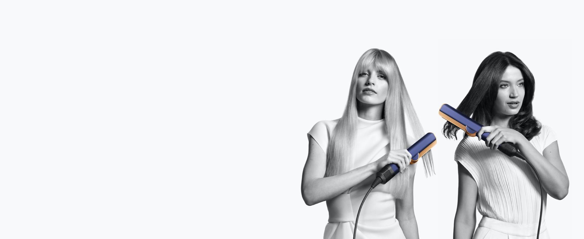 Kaks modelli kasutamas Dyson Airstraiti sirgendajat.