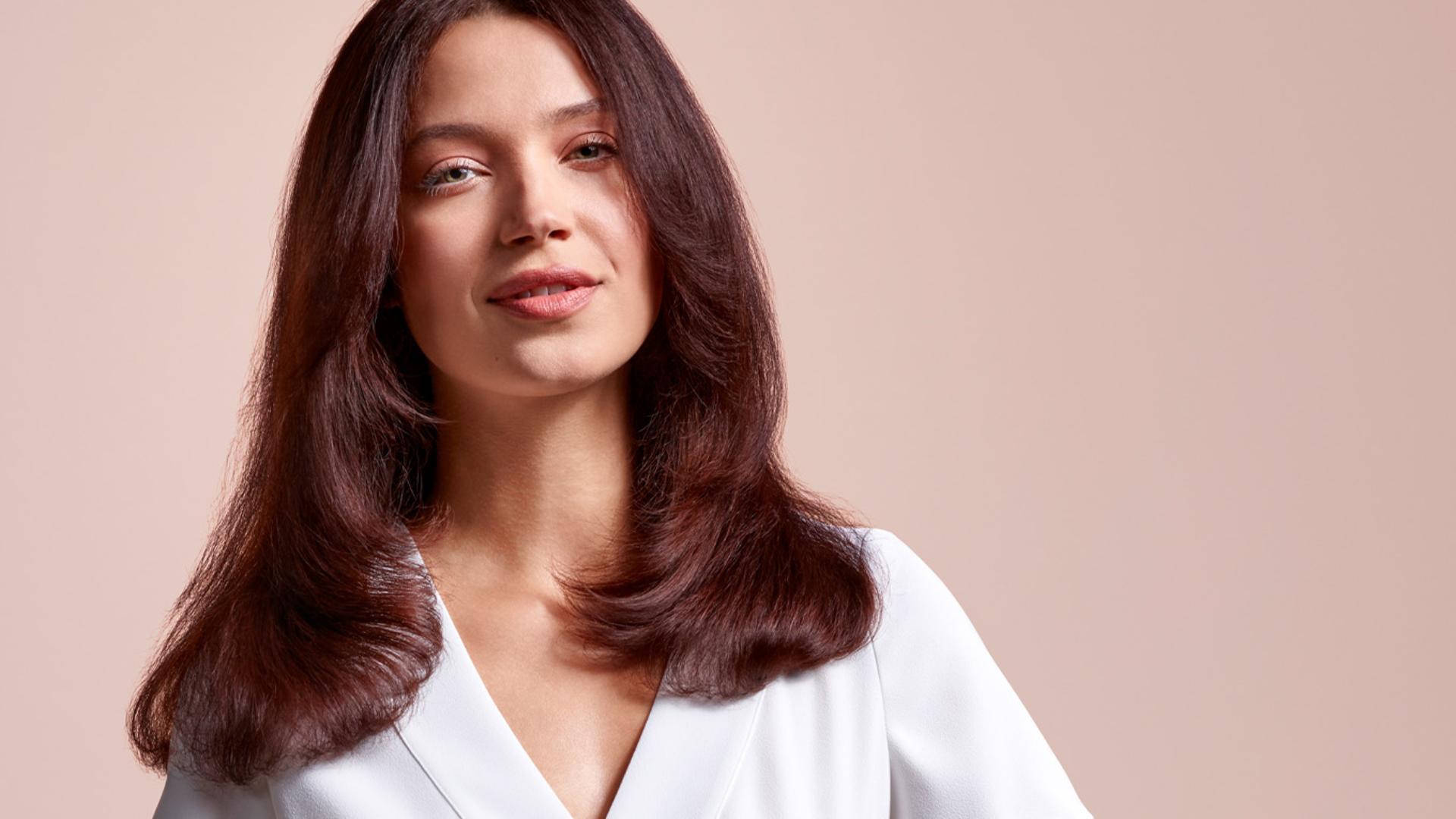 Model wearing a voluminous '90-inspired blow out style.