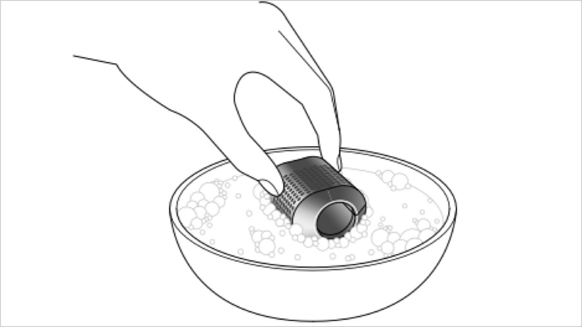 Illustration of a filter being washed in a bowl of water.