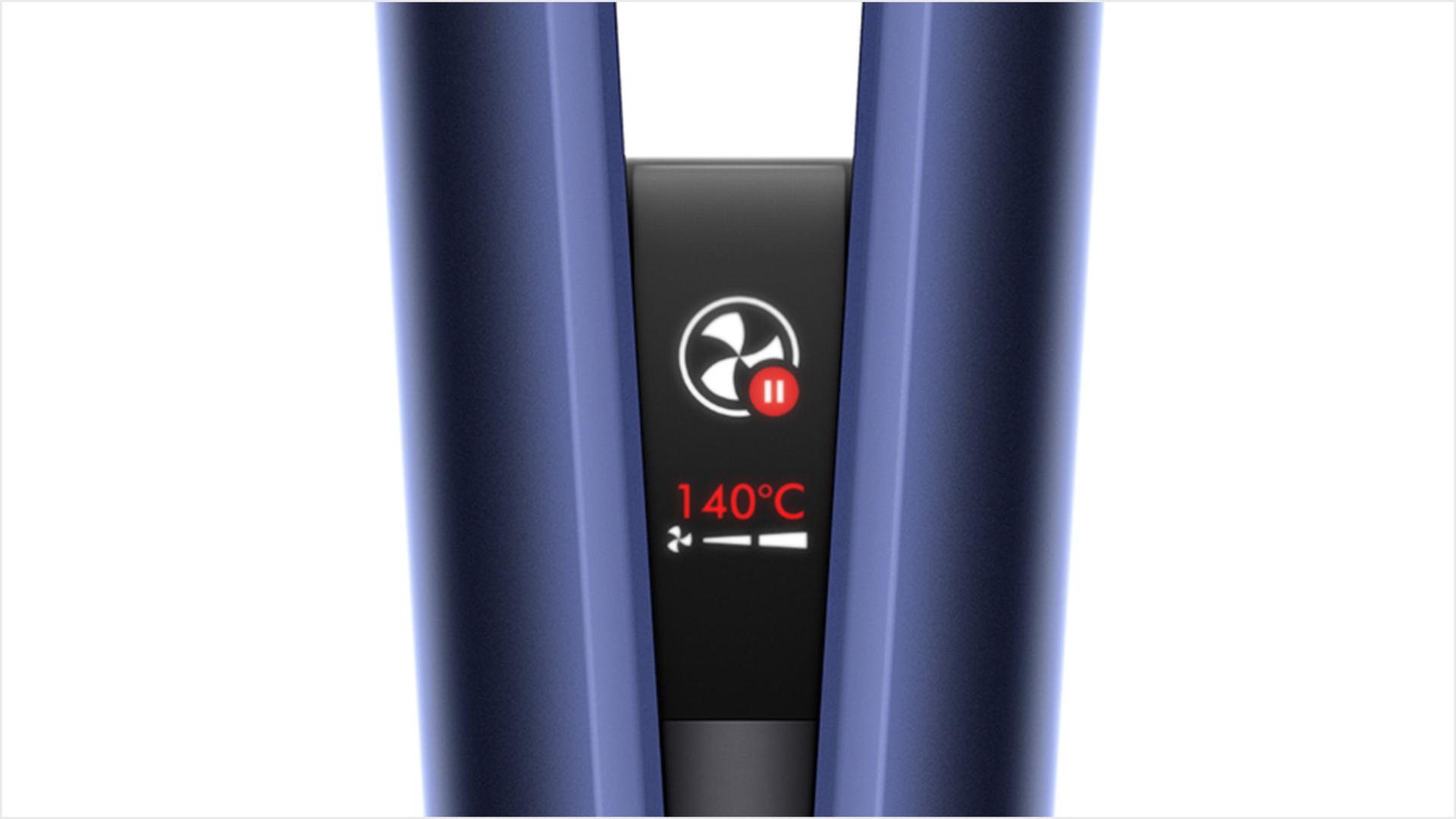 Close-up of the Dyson Airstrait LCD screen, showing the auto-pause animation.