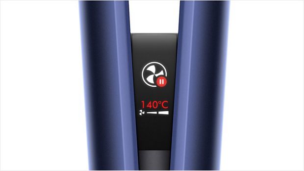Close-up of the Dyson Airstrait LCD screen, showing the auto-pause animation.