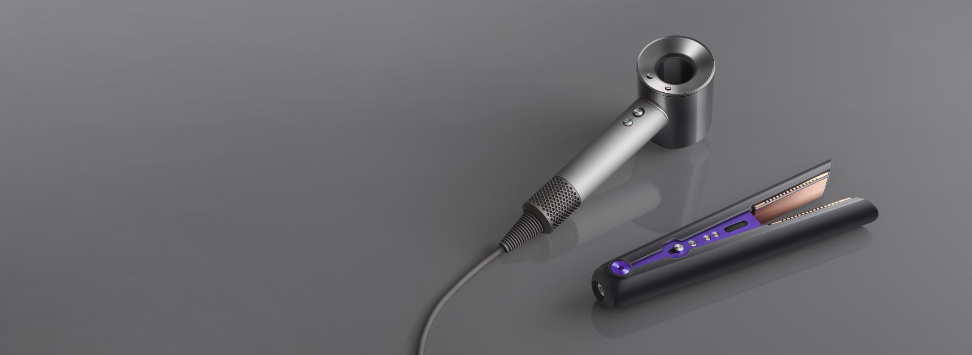 Dyson Supersonic hair dryer Pro Edition beside the Dyson Corrale straightener