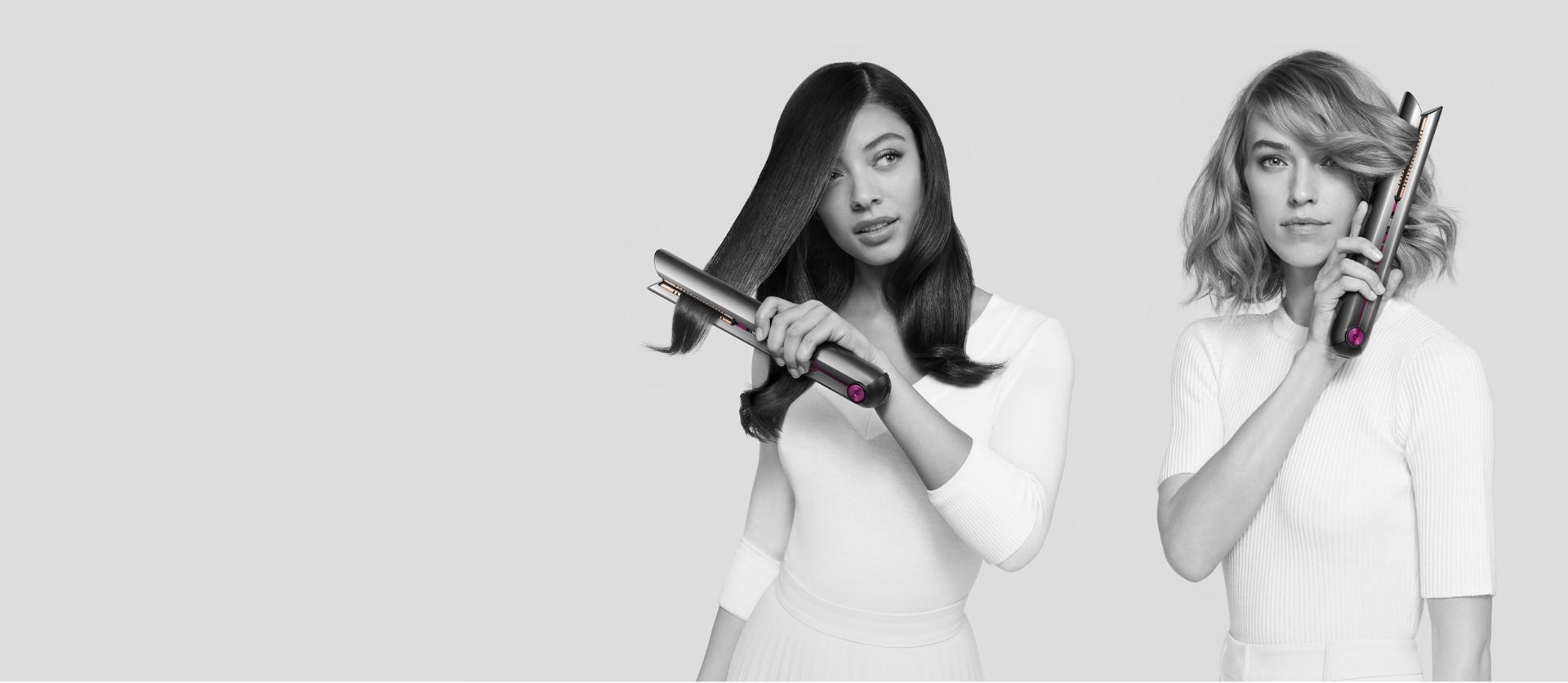 Image of two models styling with the Dyson Corrale™ straightener