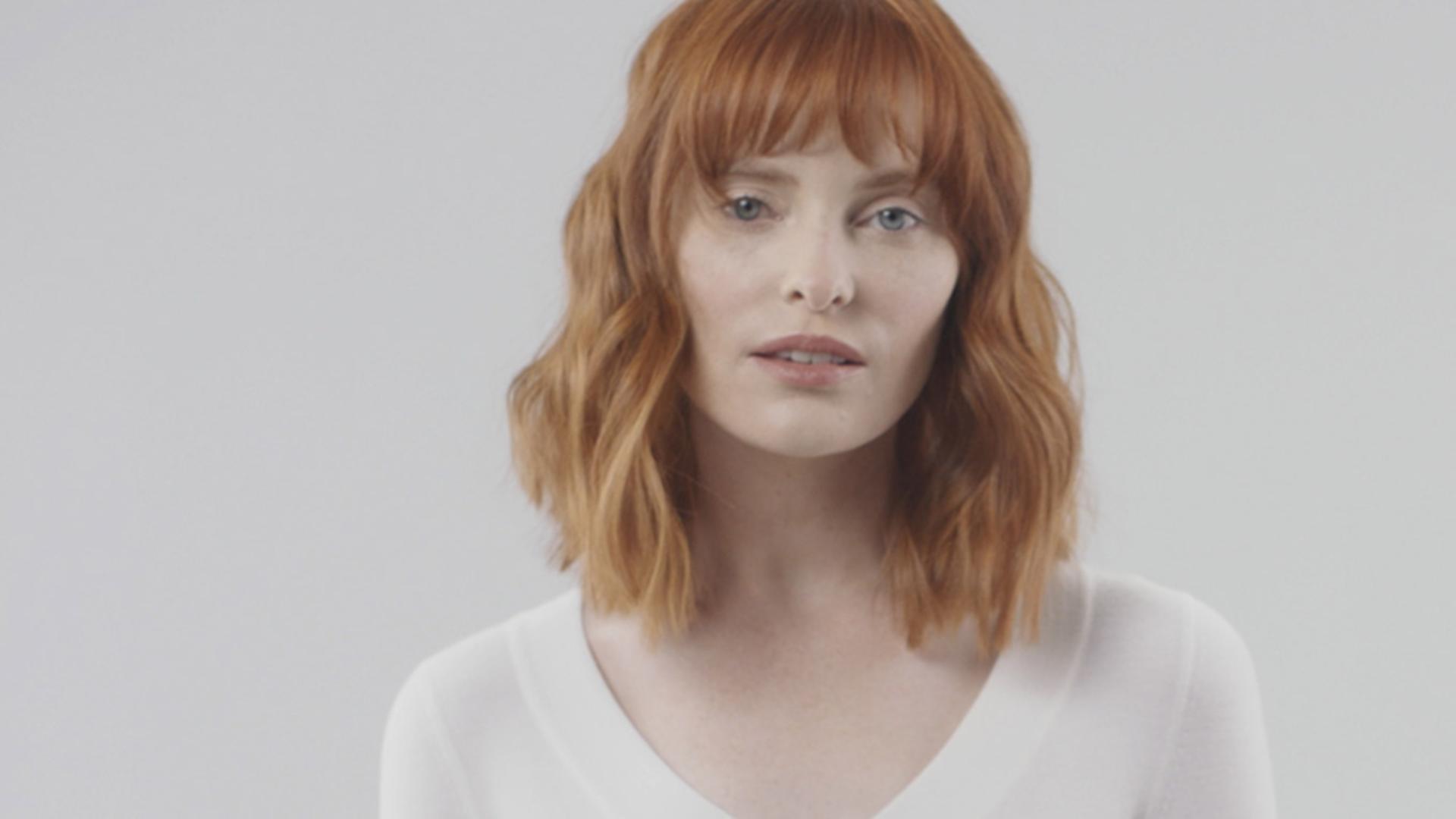 Model wearing a flat beach wave style