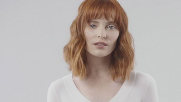 Model wearing a flat beach wave style