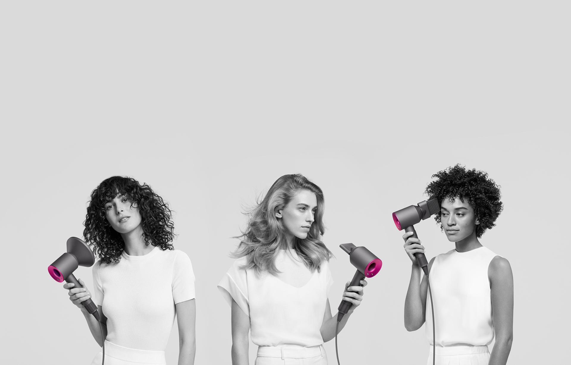 Three women using the Dyson Supersonic hair dryer