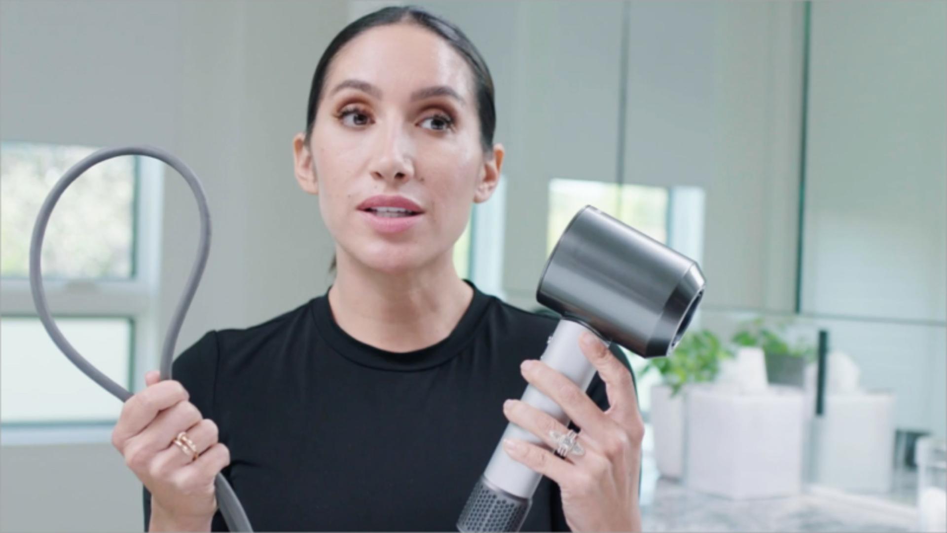 Jen Atkin showing the longer cord for the dyson Supersonic hair dryer