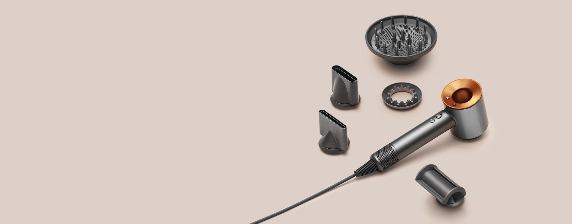 Nickel and copper Dyson Supersonic with five styling attachments