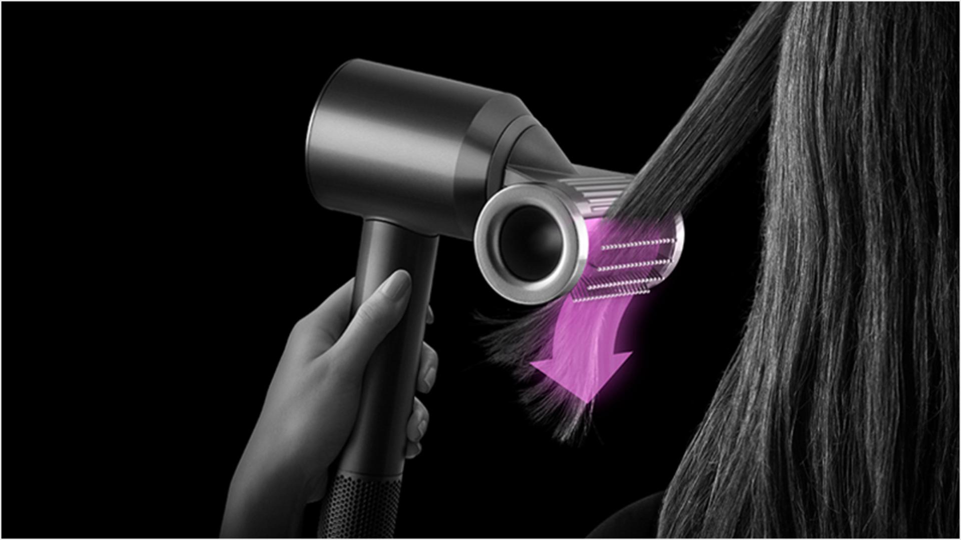 A tress of hair is styled using the Dyson Supersonic with Flyaway smoother attachment in Smoothing mode.