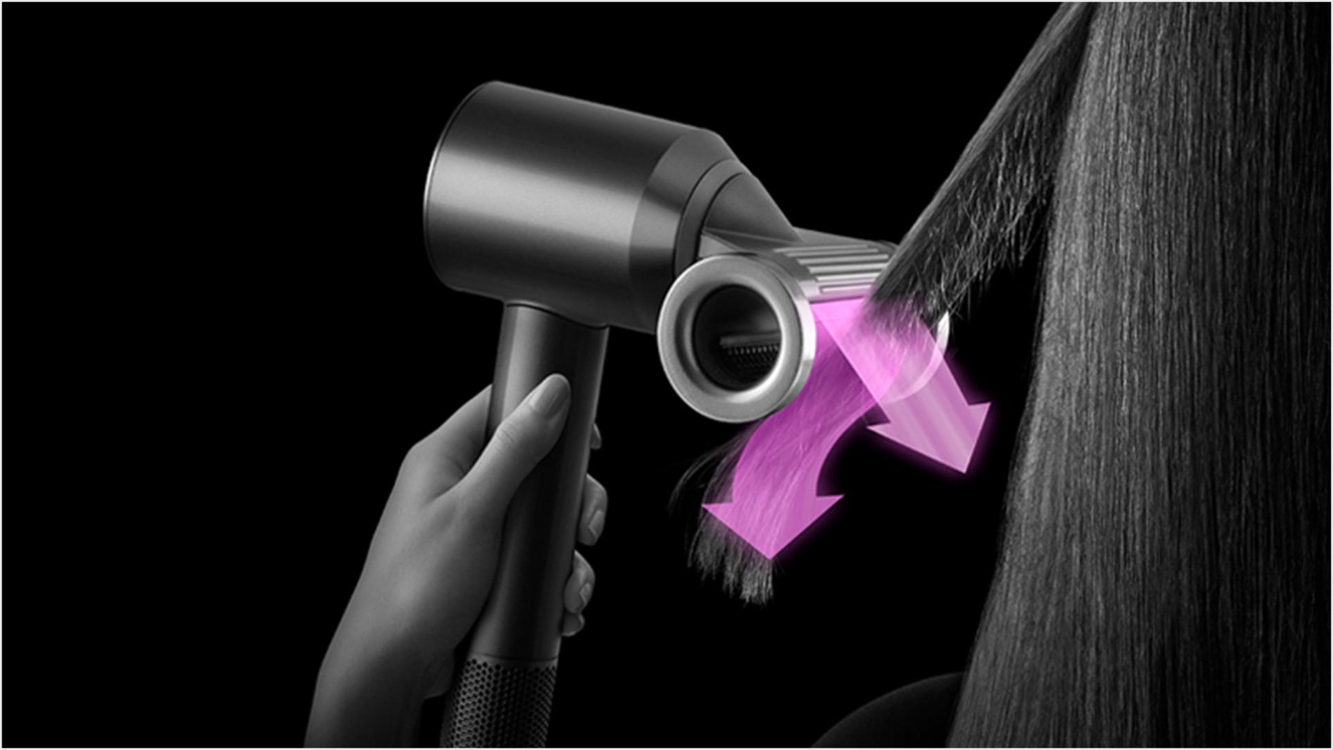 A tress of hair is styled using the Dyson Supersonic with Flyaway smoother attachment in Flyaway mode.