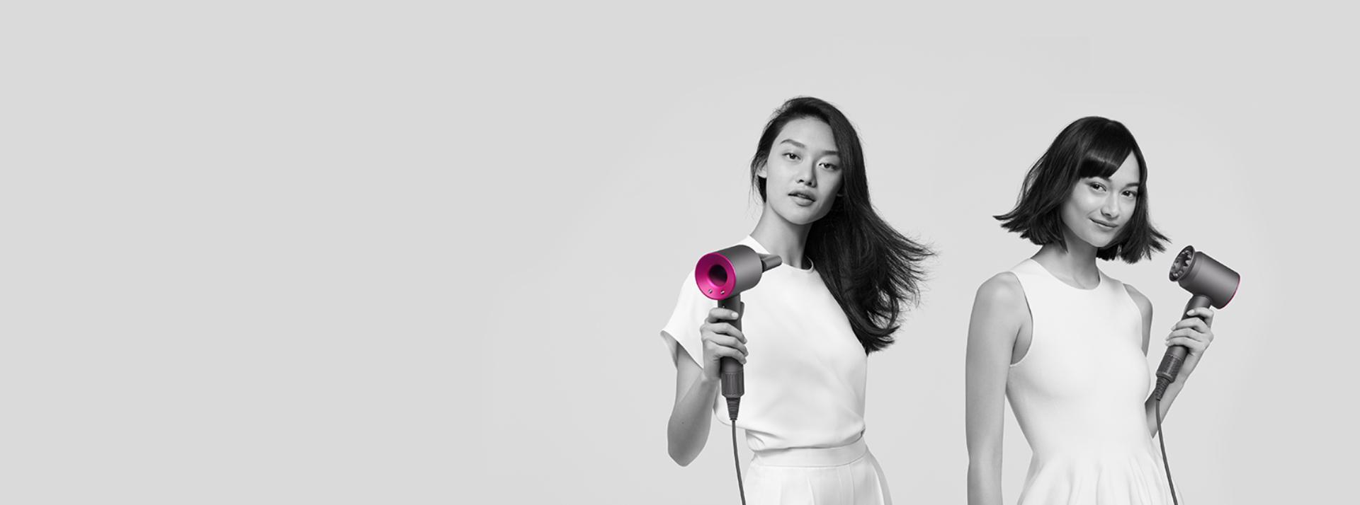 Three women using Dyson Supersonic hair dryers