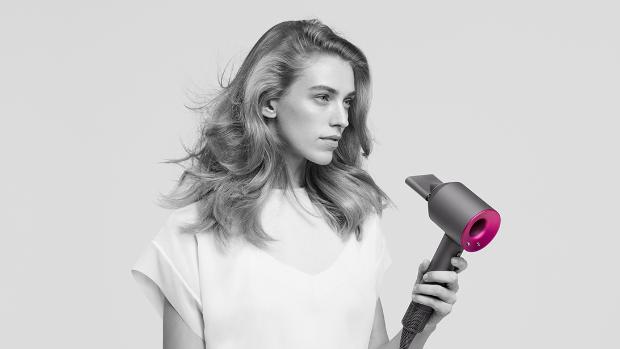 Model using Dyson Supersonic™ hair dryer