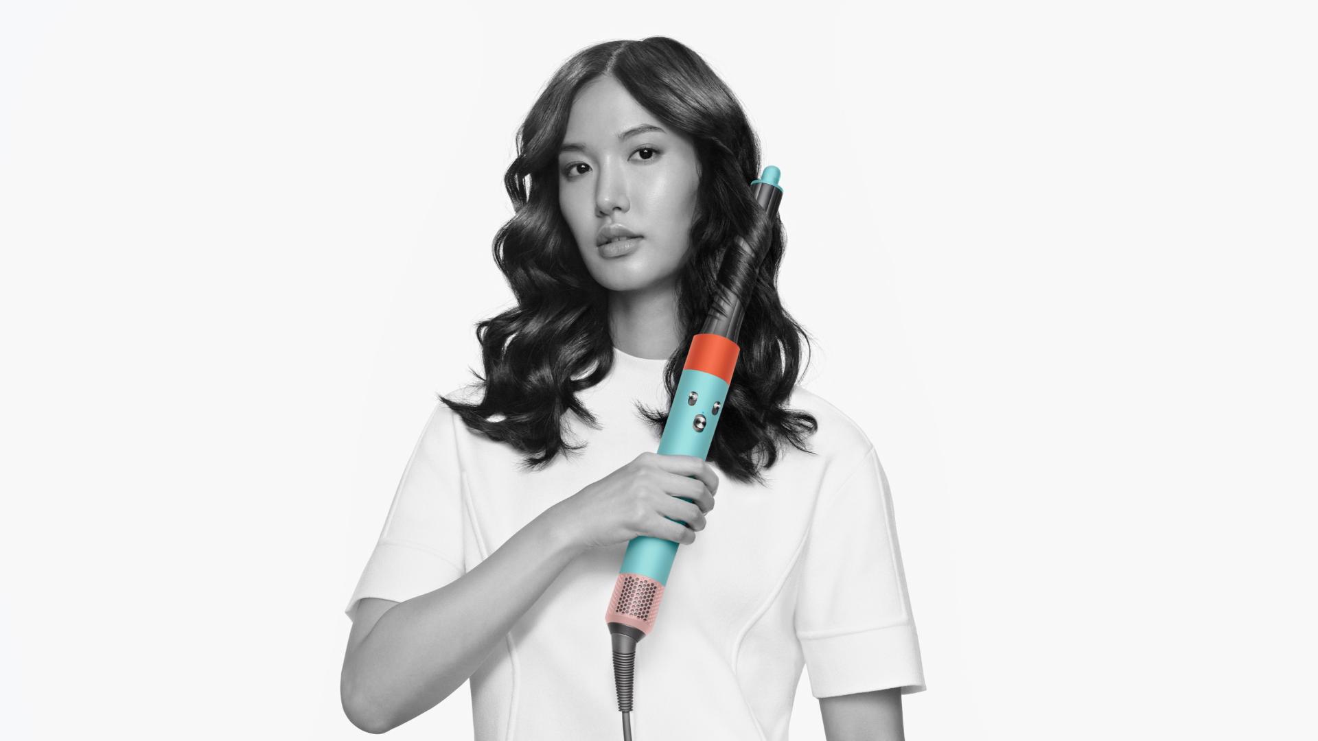 A model using the Dyson Airwrap multi-styler and dryer