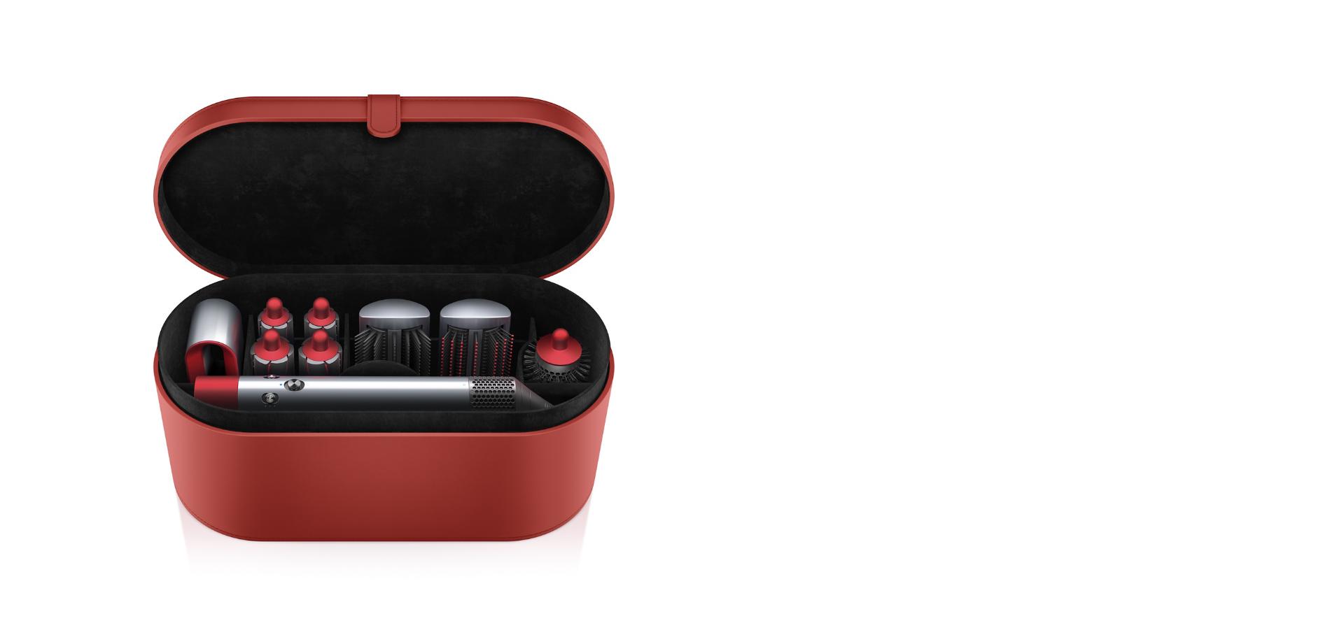 Red Dyson Airwrap styler and attachments inside presentation case 