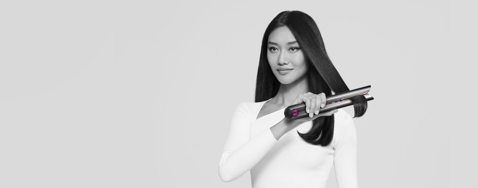A model using the Dyson Corrale straightener
