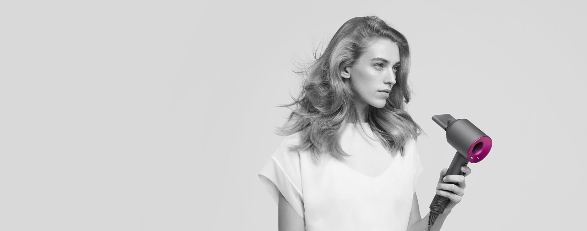 A model using the Dyson Supersonic hair dryer
