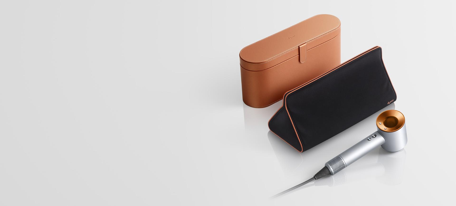 Copper Dyson Supersonic hair dryer with presentation case and storage bag