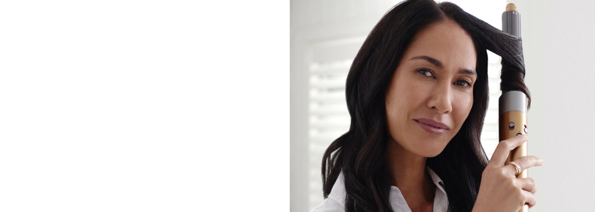 Model using Dyson Airwrap multi-styler