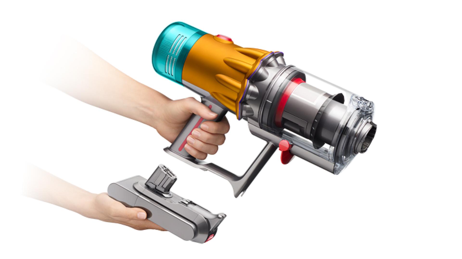 The click-in battery is removed from the Dyson V12 vacuum cleaner.
