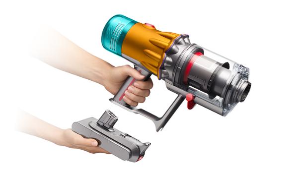 The click-in battery is removed from the Dyson V12 vacuum cleaner.