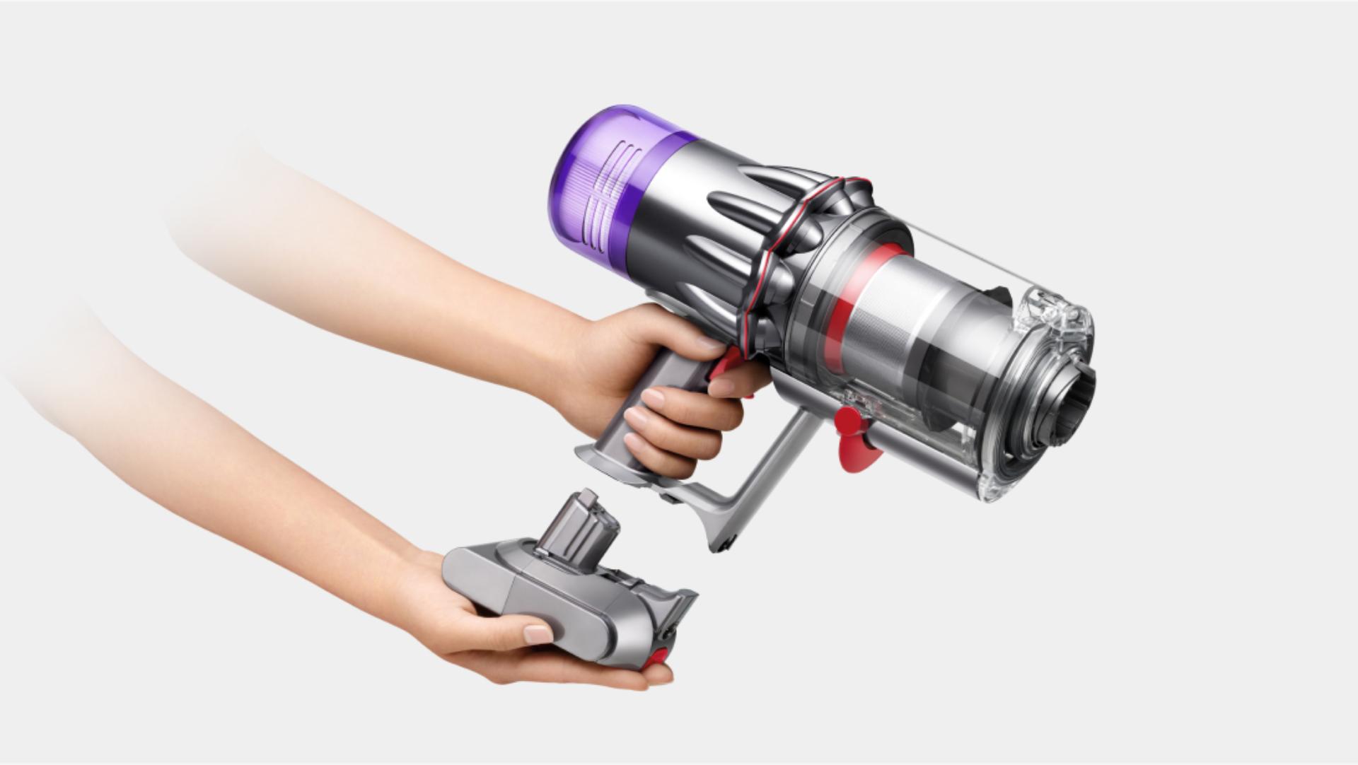 The battery is clicked into the handle of the Dyson V9 vacuum.