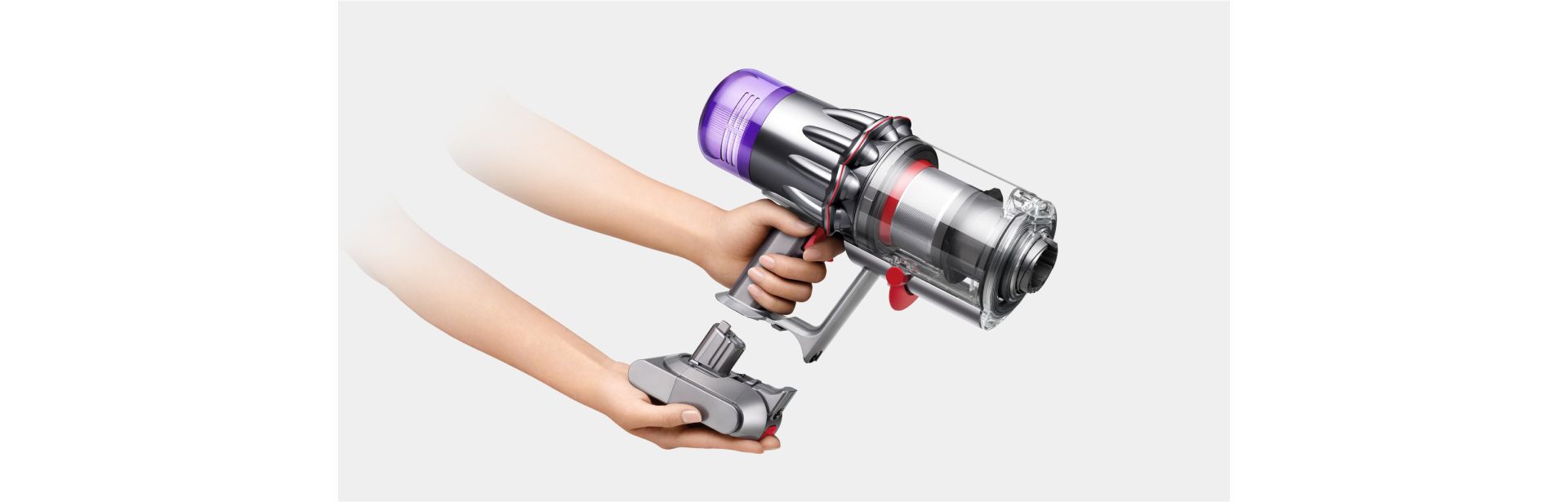 The battery is clicked into the handle of the Dyson V9 vacuum.