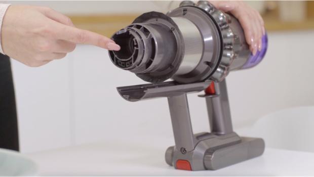 A Dyson owner checks their V9 vacuum for blockages.