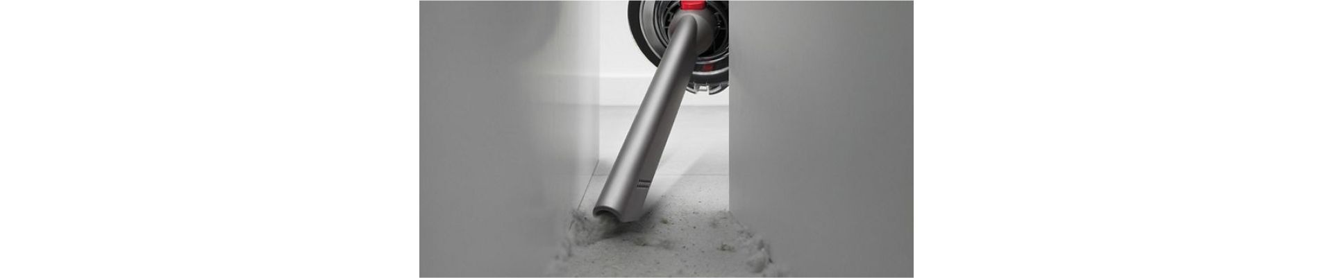 The Crevice tool is used to clean behind a cabinet.