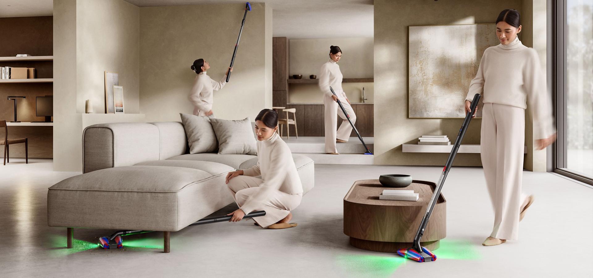 다이슨 PencilVac™ 펜슬백 청소기로 테이블 아래를 청소하는 모습