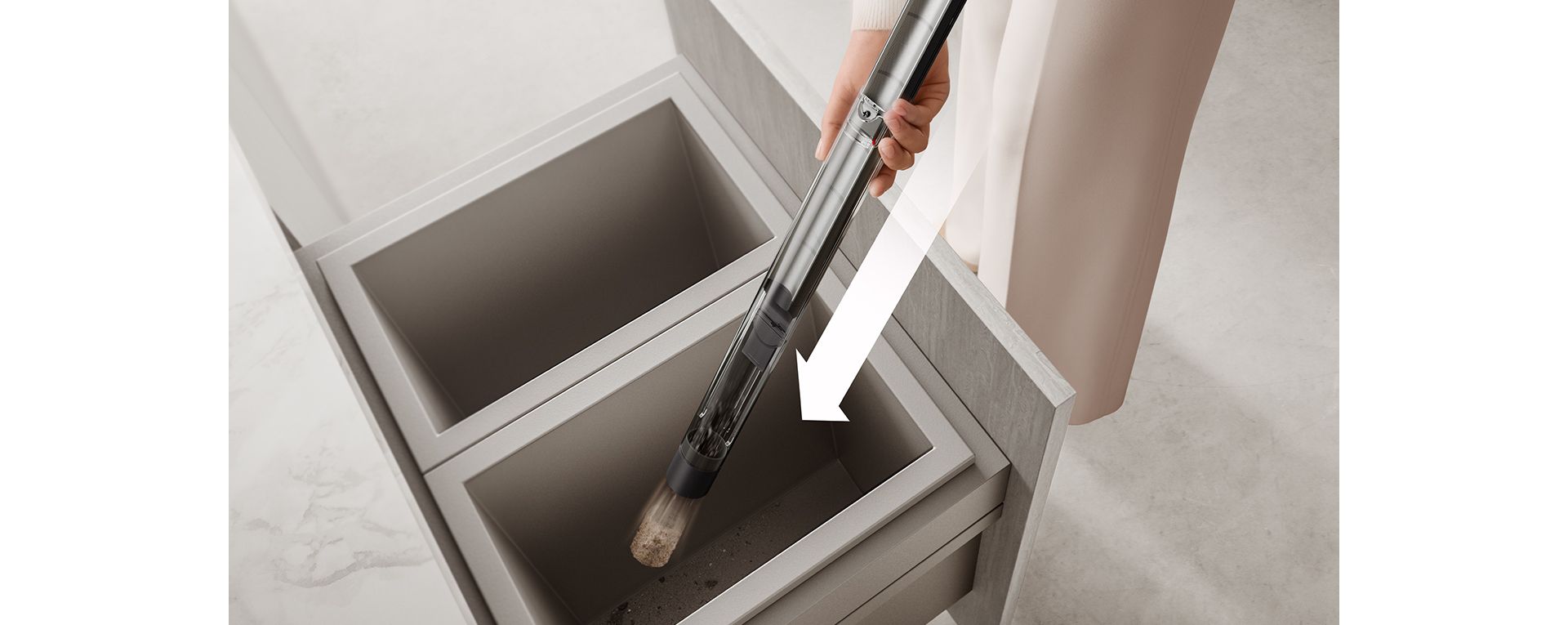 다이슨 pencilVac™ 먼지통을 비우는 모습