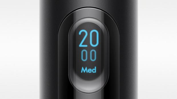 A close up of the LCD screen of the Dyson PencilVac cleaner, showing the number 20 and the Medium symbol