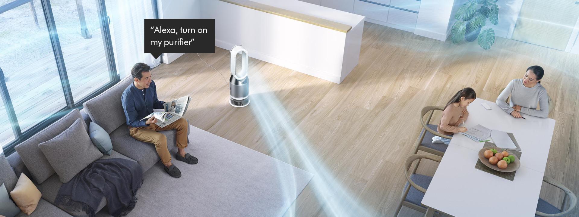 Man on a sofa asking Dyson purifier to purify a room.
