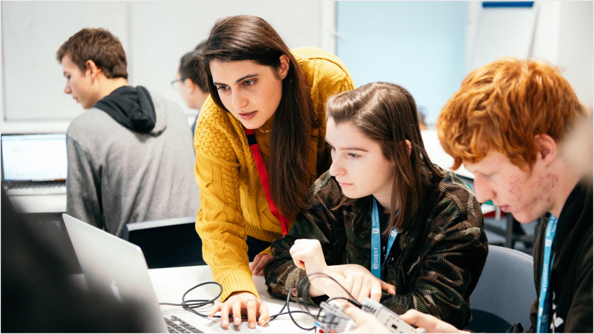 Young engineers working on prototypes.
