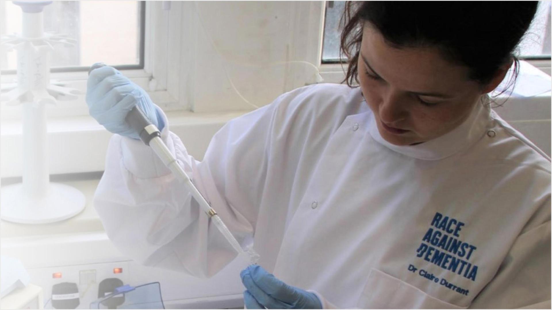 Dr Claire Durrant working in a lab.