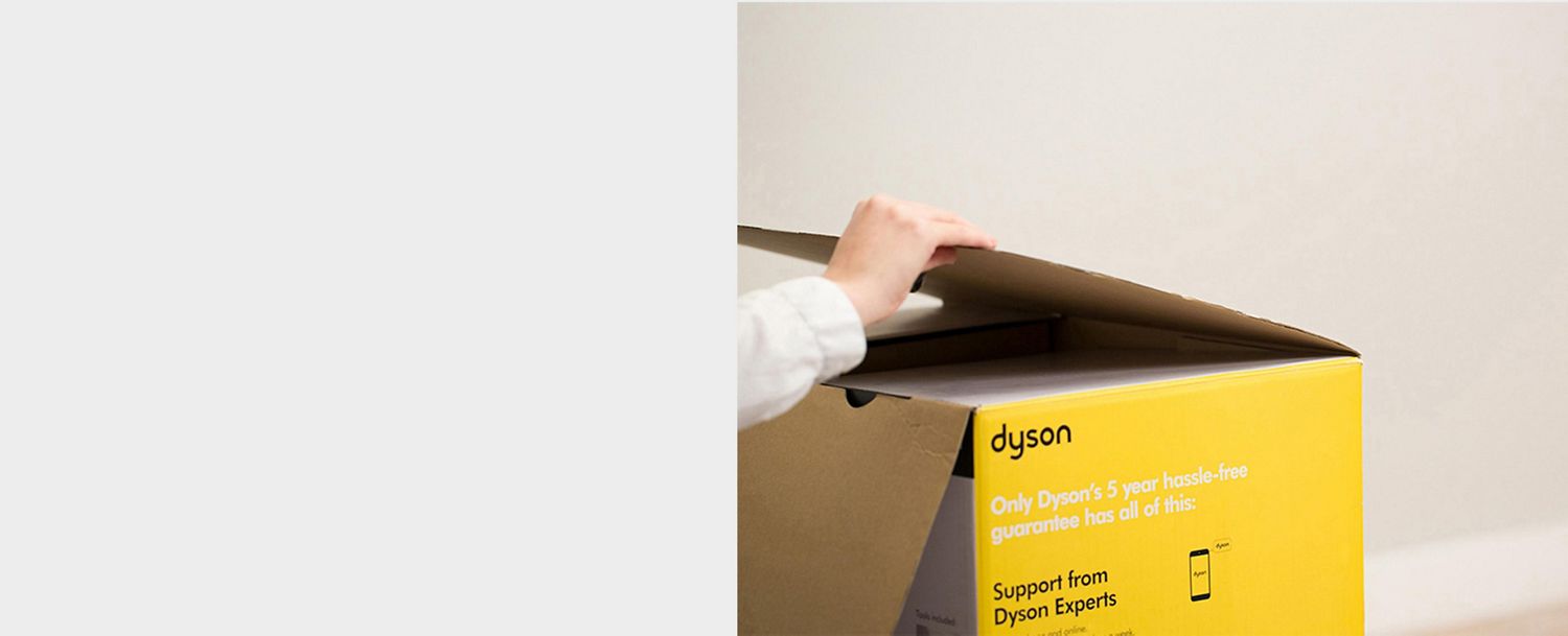 A hand opening a box