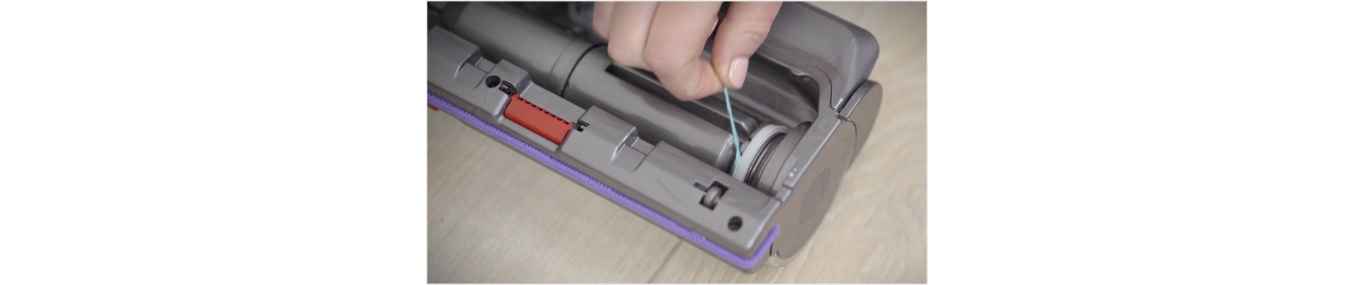 Image from video about detangling the brush bar