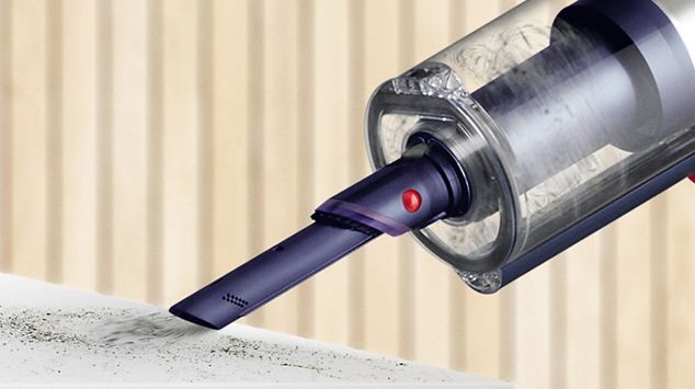 Built-in dusting and crevice tool cleaning a shelf.