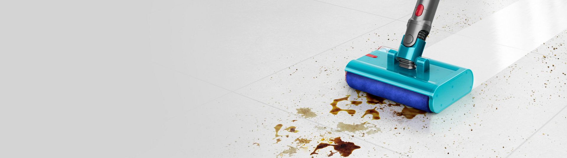 Submarine wet roller cleaner head removing a dirty spill from a hard floor.