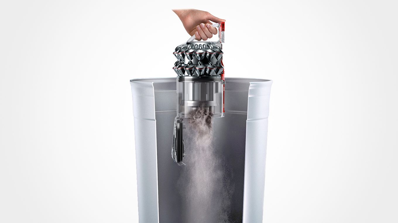 Bildet viser hvordan du tømmer beholderen.