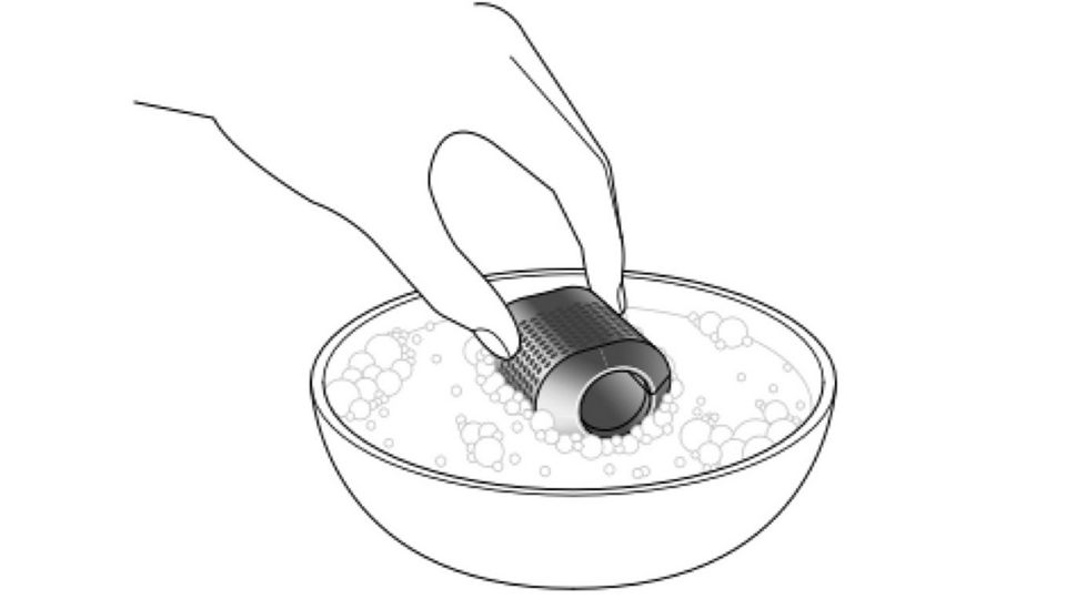 Illustration of a filter being washed in a bowl of water.