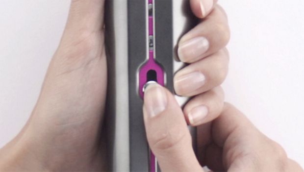 Thumb sliding Lock button on Dyson Corrale straightener.