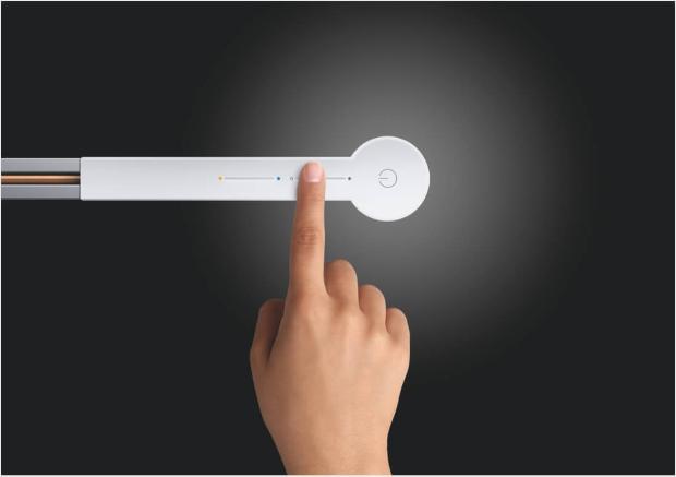 Person using the slide-touch controls on top of light